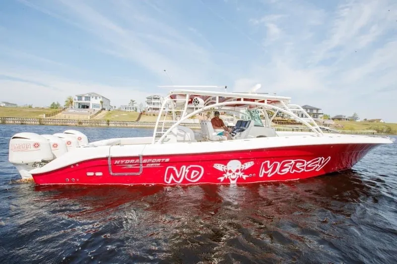 Slide: The Image of 2013 Hydra-Sports 42 Siesta boat with No Mercy graphics on the water. - 6