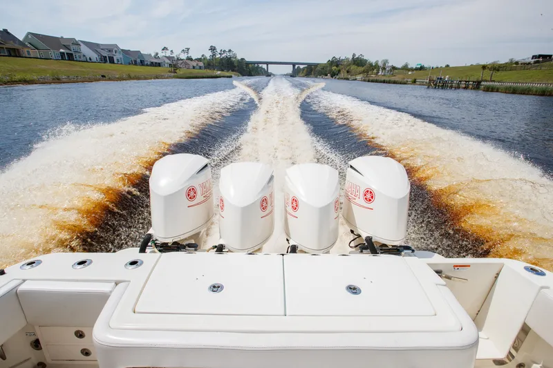 Slide: The Image of 2013 Hydra-Sports 42 Siesta boat with Yamaha engines cruising on a scenic waterway. - 8