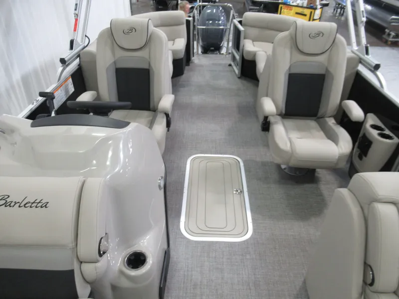 Slide: The Image of 2023 Barletta C22QC pontoon boat interior with plush seating and modern design. - 3