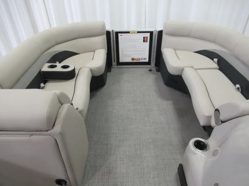 Slide: The Image of 2023 Barletta C22QC pontoon boat interior with plush seating and cup holders. - 4