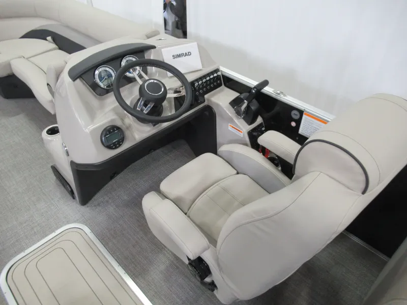Slide: The Image of 2023 Barletta C22QC boat interior with steering console and comfortable seating. - 6