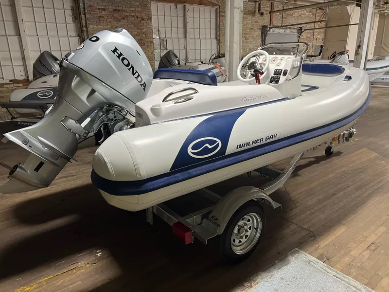 The Image of 2023 Walker Bay Generation 360 boat with Honda outboard motor on trailer. - 0