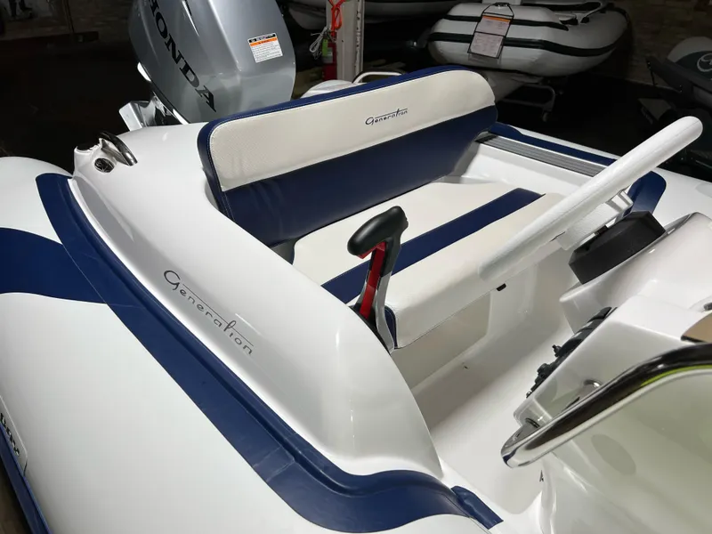 Slide: The Image of 2023 Walker Bay Generation 360 boat interior with blue and white seating. - 5