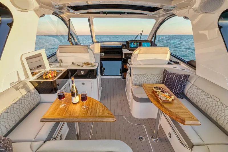 Slide: The Image of Luxurious interior of 2023 Sea Ray Sundancer 370 Outboard yacht with dining setup. - 26