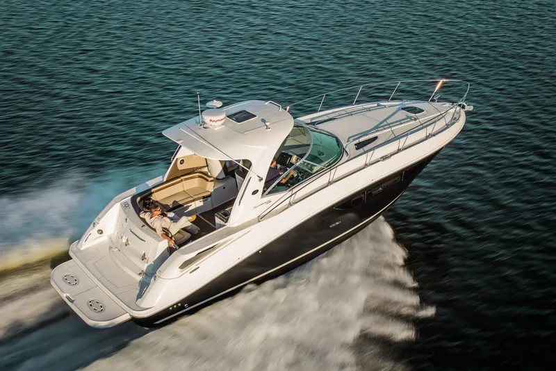 Slide: The Image of 2023 Sea Ray Sundancer 370 Outboard cruising on open water. - 39