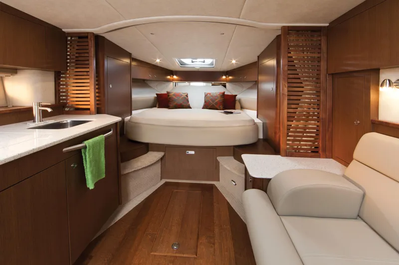 Slide: The Image of Luxurious interior of 2023 Sea Ray Sundancer 370 Outboard with modern amenities and cozy sleeping area. - 42