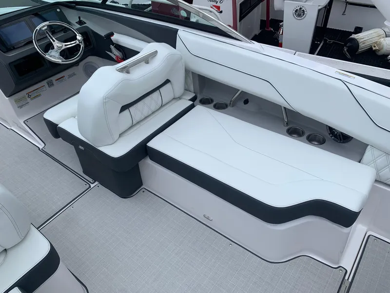 Slide: The Image of Open storage compartment in 2026 Regal LX4 boat, showcasing spacious interior design. - 10