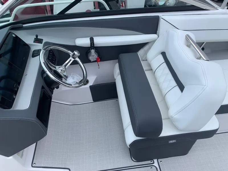 Slide: The Image of Luxurious interior of 2026 Regal LX4 boat with plush seating and cup holders. - 15