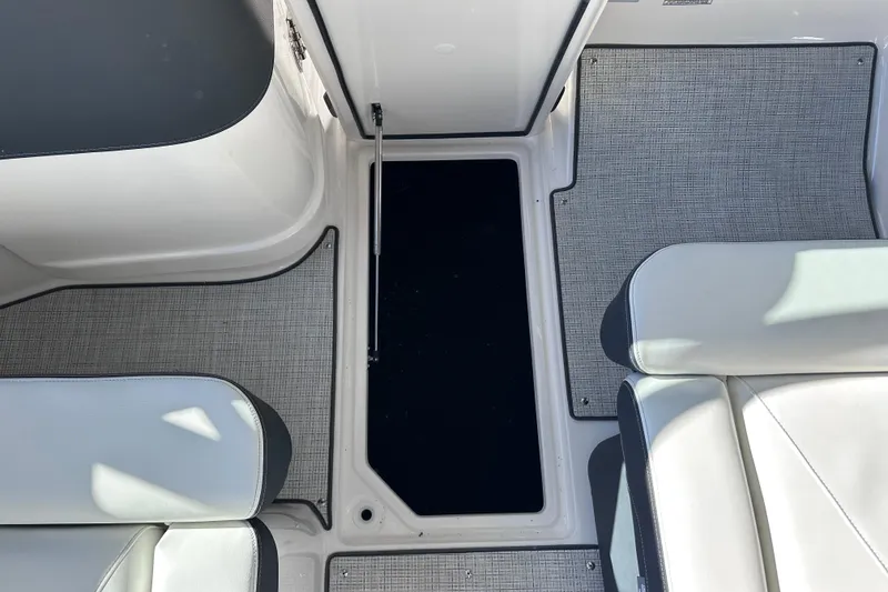 Slide: The Image of 2026 Regal LX4 boat interior with sleek seating and textured flooring. - 22