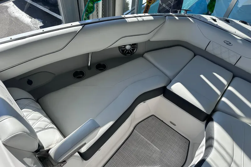 Slide: The Image of Luxurious interior of 2026 Regal LX4 boat with plush seating and cup holders. - 24