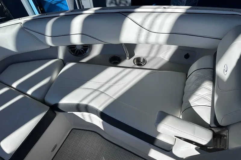 Slide: The Image of Luxurious interior of 2026 Regal LX4 boat with white leather seating and cup holders. - 26