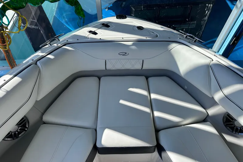 Slide: The Image of 2026 Regal LX4 boat interior with luxurious white seating and modern design. - 29