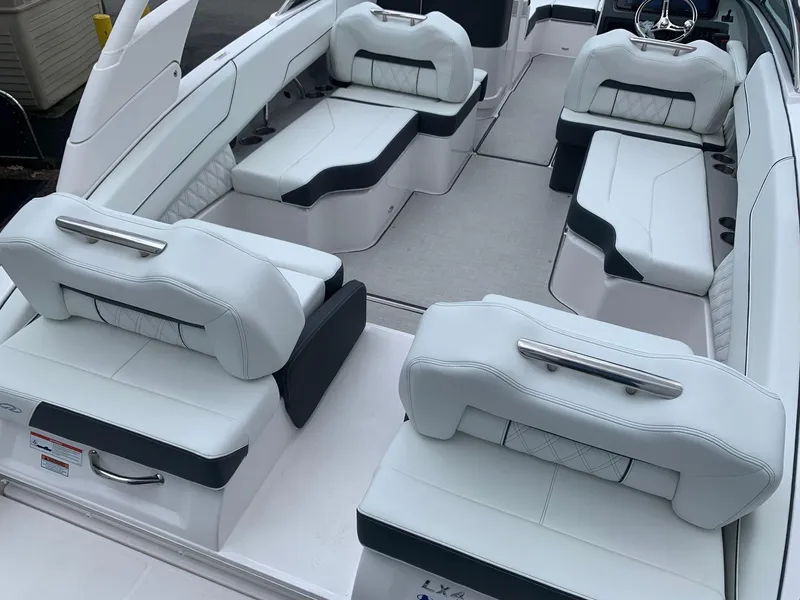 Slide: The Image of 2026 Regal LX4 boat interior with luxurious white seating and modern design. - 8