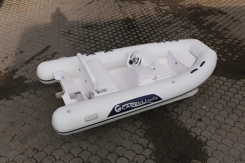 Slide: The Image of 2022 Capelli Tempest 340 LE Tender, white inflatable boat on paved surface. - 3
