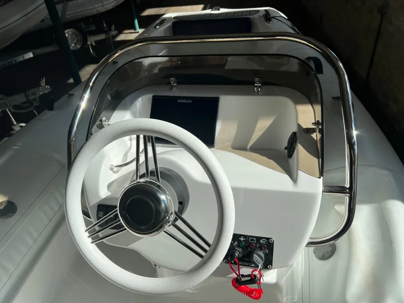 Slide: The Image of 2023 Walker Bay Generation 400 boat steering console with stainless steel frame. - 3