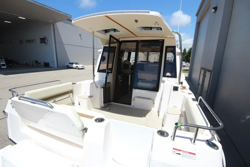 Slide: The Image of 2026 Ranger Tugs R-29 S boat with spacious deck and modern interior design. - 11