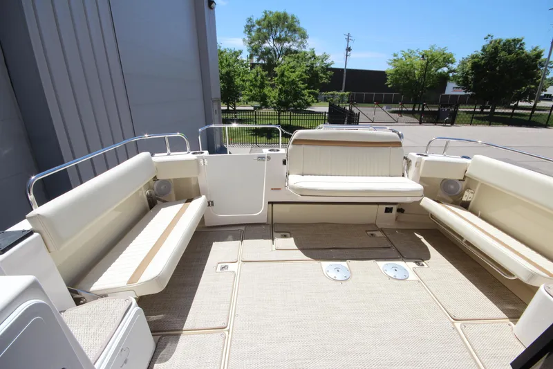 Slide: The Image of Spacious deck of 2026 Ranger Tugs R-29 S with comfortable seating and sunny outdoor view. - 13