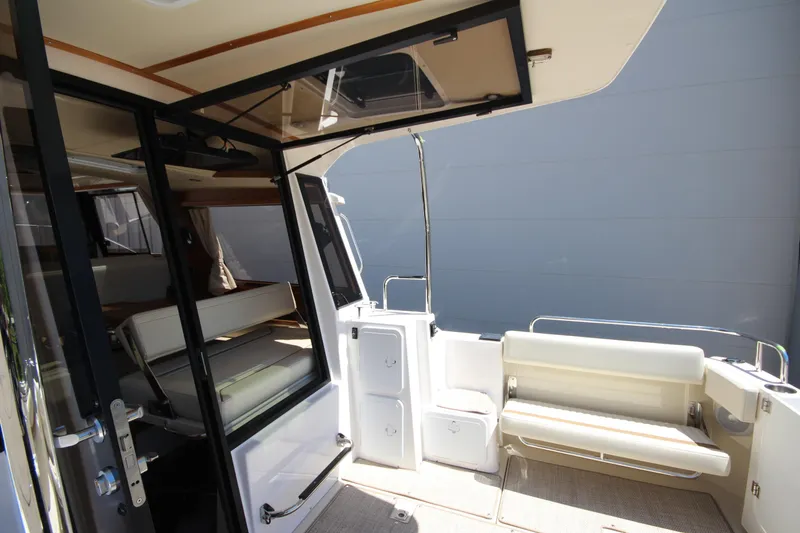 Slide: The Image of 2026 Ranger Tugs R-29 S boat interior with seating and storage compartments. - 16