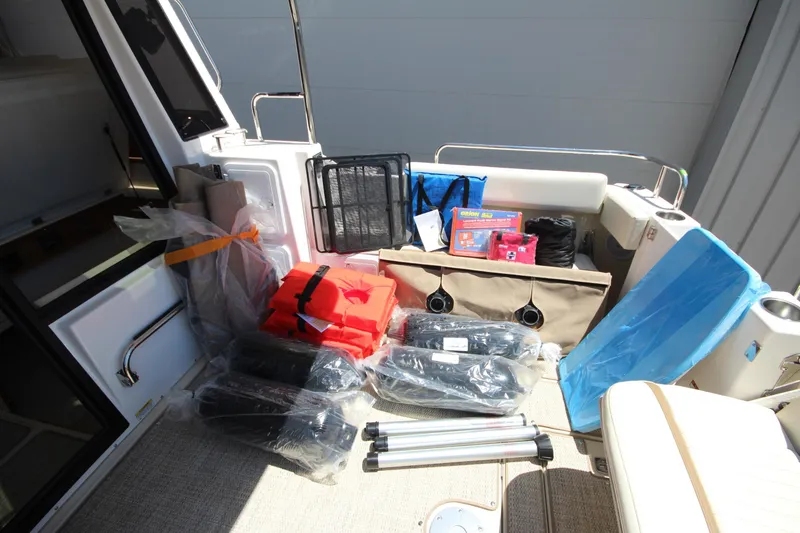 Slide: The Image of 2026 Ranger Tugs R-29 S boat interior with safety gear and accessories. - 53