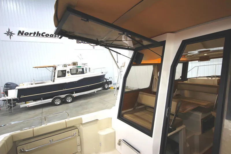 Slide: The Image of 2025 Ranger Tugs R-23 boat interior and exterior view in showroom. - 21