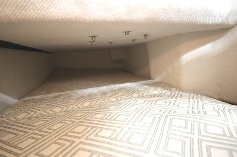 Slide: The Image of Interior cabin of 2025 Ranger Tugs R-23 with patterned upholstery. - 39