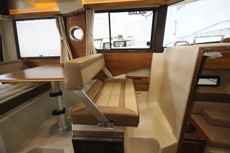 Slide: The Image of Interior seating and dining area of 2025 Ranger Tugs R-23 boat. - 42