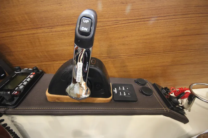 Slide: The Image of Ranger Tugs R-23 2025 boat throttle control and dashboard. - 47