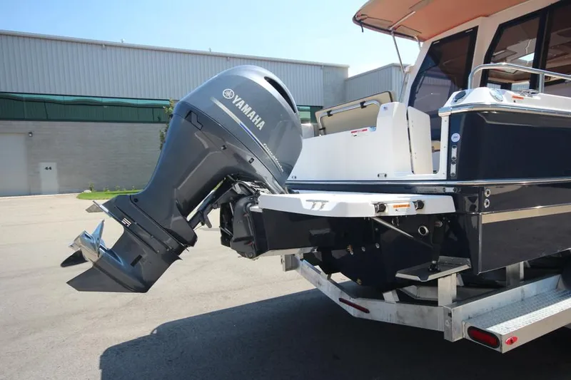 Slide: The Image of 2025 Ranger Tugs R-23 boat with Yamaha outboard motor on trailer. - 9