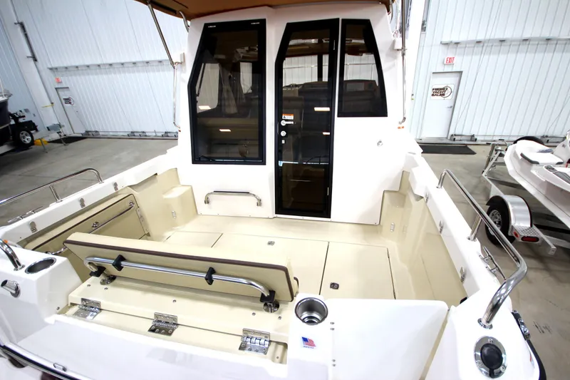 Slide: The Image of 2025 Ranger Tugs R-23 boat interior, spacious deck, modern design. - 13
