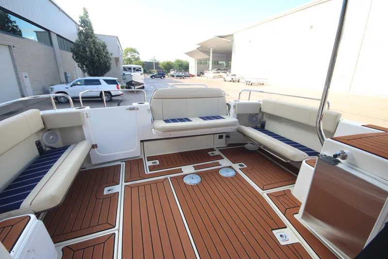 Slide: The Image of 2025 Ranger Tugs R-29 Command Bridge Luxury Edition boat interior with elegant seating and wood flooring. - 15
