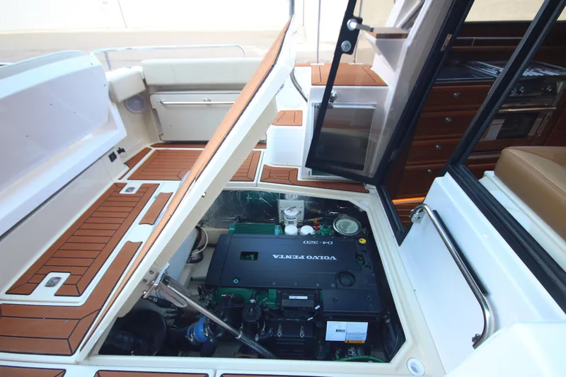 Slide: The Image of 2025 Ranger Tugs R-29 Command Bridge engine compartment with Volvo Penta engine. - 19