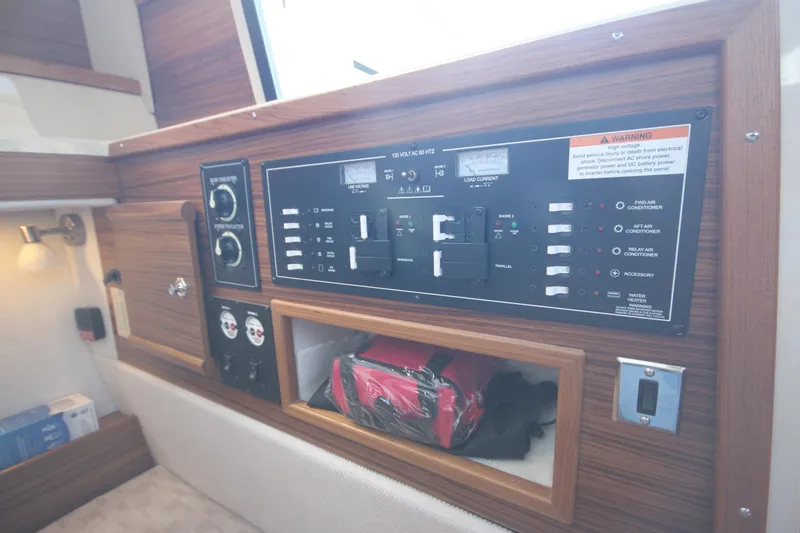Slide: The Image of Control panel inside 2025 Ranger Tugs R-29 Command Bridge Luxury Edition boat cabin. - 36