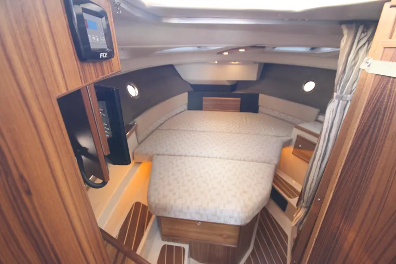 Slide: The Image of Luxurious cabin interior of 2025 Ranger Tugs R-29 Command Bridge, featuring elegant wood finishes. - 43