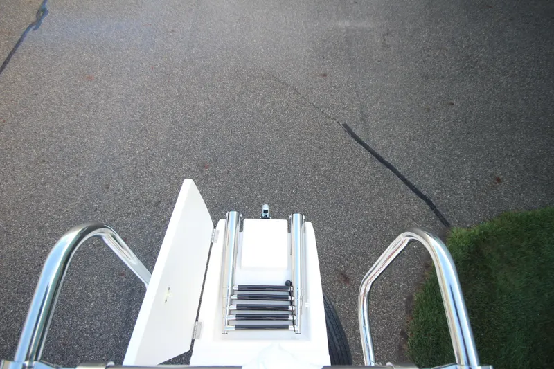 Slide: The Image of Top view of 2025 Ranger Tugs R-29 Command Bridge ladder and open hatch. - 55
