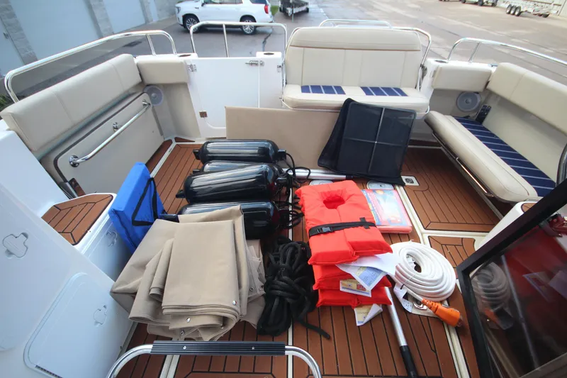 Slide: The Image of 2025 Ranger Tugs R-29 Command Bridge deck with safety gear and accessories. - 58