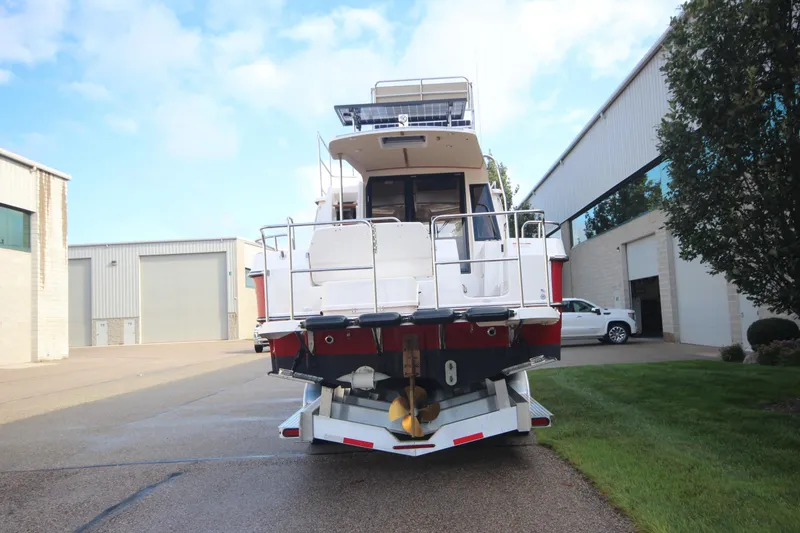 Slide: The Image of 2025 Ranger Tugs R-29 Command Bridge Luxury Edition on trailer, rear view. - 6