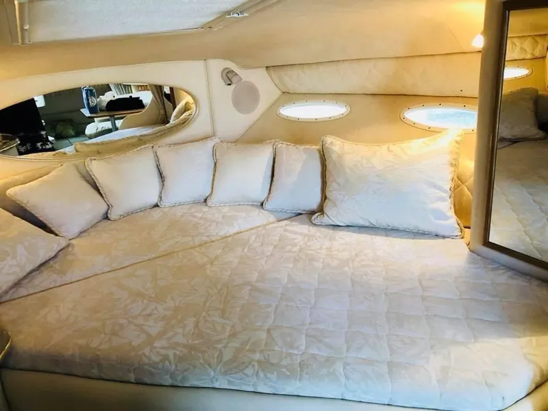 Slide: The Image of Interior cabin of 2000 Sea Ray Sundancer 310 with cozy bedding. - 15