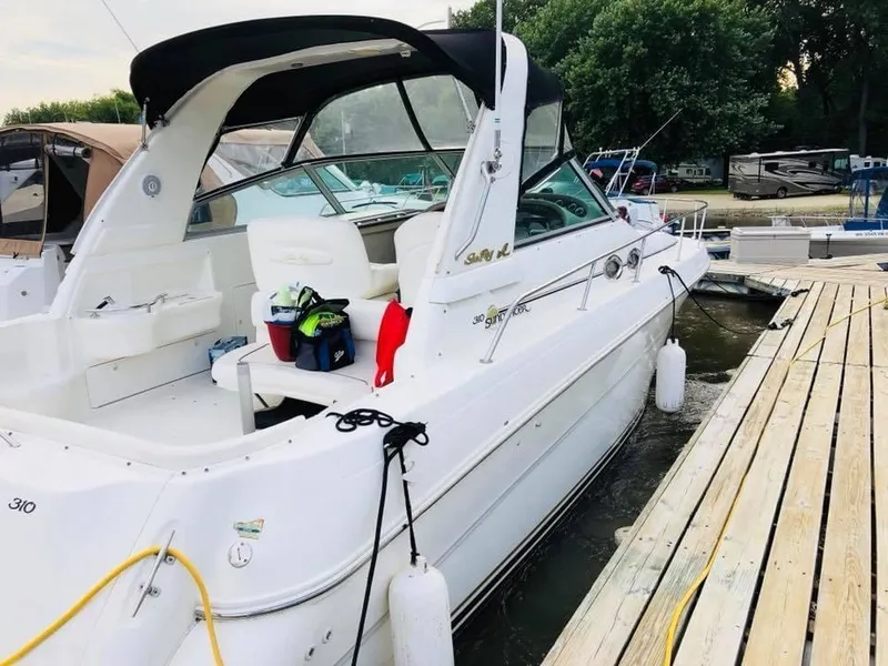 Slide: The Image of 2000 Sea Ray Sundancer 310 boat docked at marina. - 17