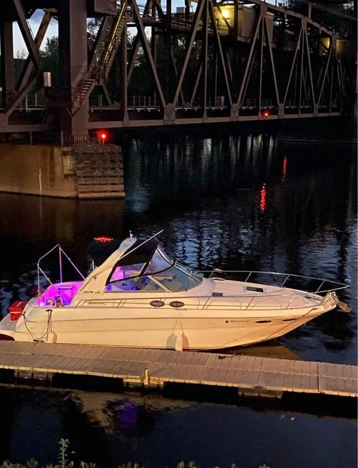 Slide: The Image of Sea Ray Sundancer 310 boat under bridge at night, year 2000. - 3