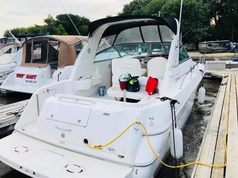 Slide: The Image of 2000 Sea Ray Sundancer 310 boat docked at marina. - 5