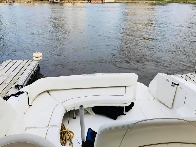 Slide: The Image of Interior of a 2000 Sea Ray Sundancer 310 yacht by the water. - 7