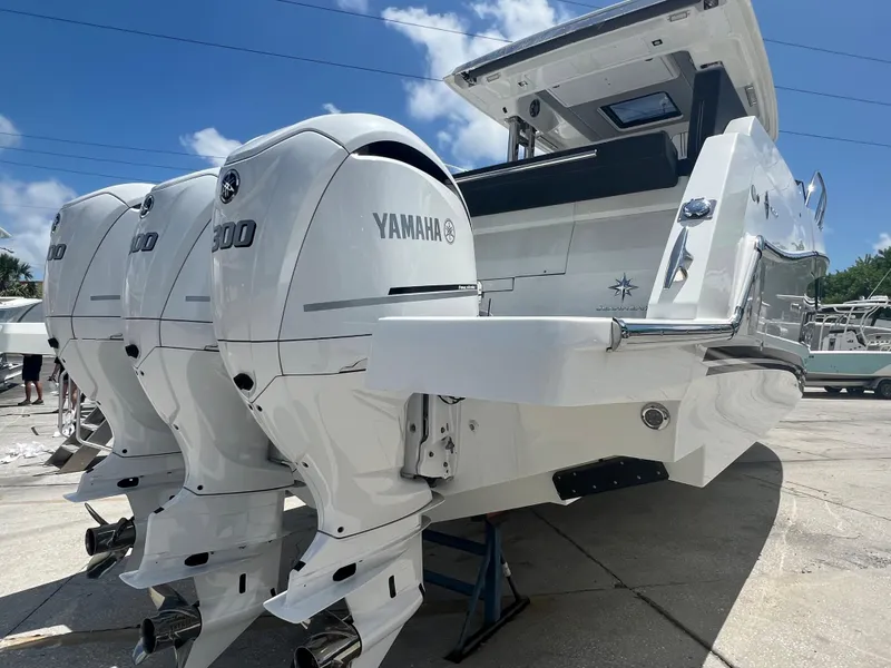 Slide: The Image of 2024 Jeanneau Leader 12.5 with triple Yamaha 300 outboard engines. - 4