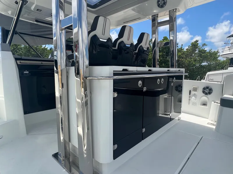 Slide: The Image of 2024 Jeanneau Leader 12.5 boat interior with sleek seating and modern amenities. - 6