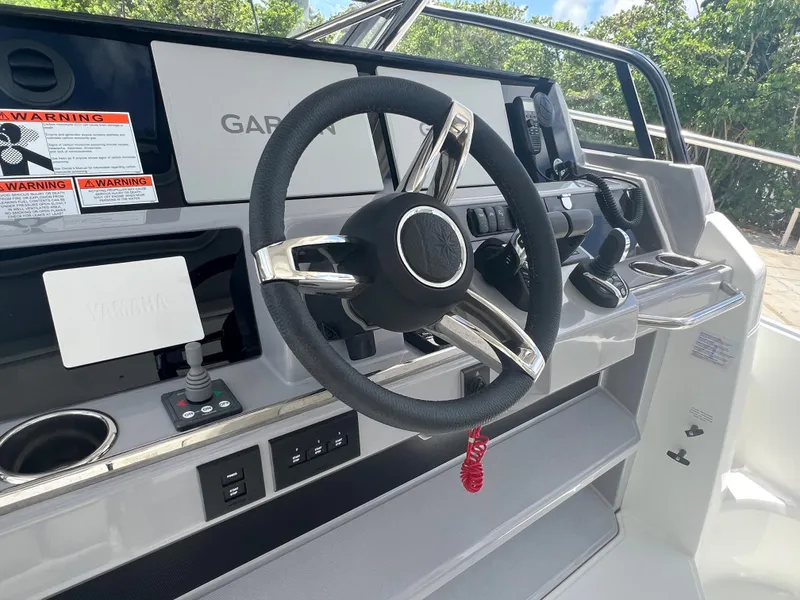 Slide: The Image of 2024 Jeanneau Leader 12.5 helm station with Garmin navigation system. - 8