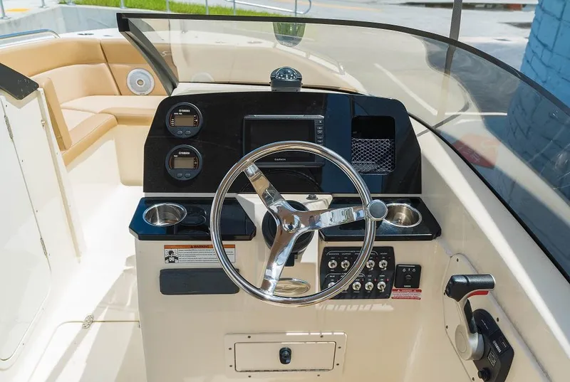 Slide: The Image of 2026 Scout 215 Dorado helm with modern controls and instruments. - 1