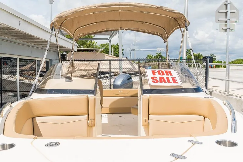 Slide: The Image of Scout 215 Dorado 2026 boat with for sale sign, beige interior. - 9