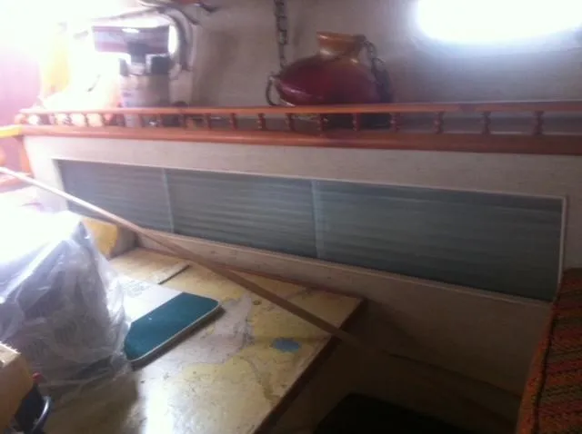 Slide: The Image of 1952 Chris-Craft Buccaneer interior with nautical decor and storage space. - 13