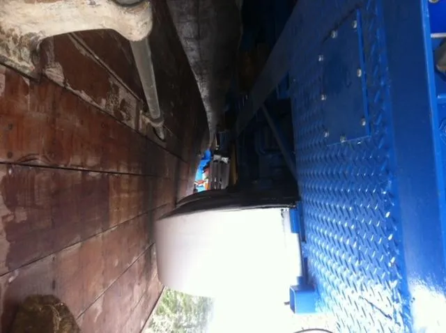 Slide: The Image of 1952 Chris-Craft Buccaneer boat hull and blue machinery close-up. - 16