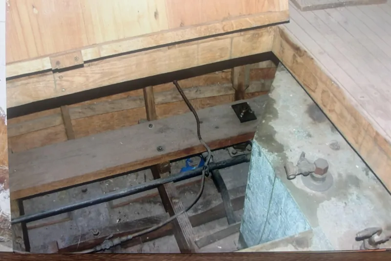 Slide: The Image of Interior view of a 1952 Chris-Craft Buccaneer boat, showing wooden construction. - 17