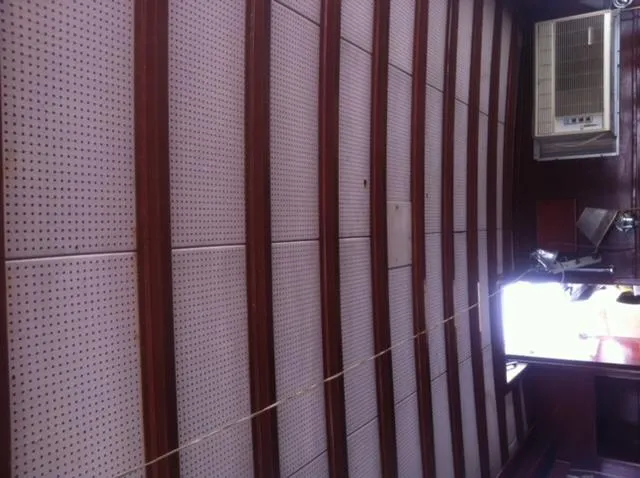 Slide: The Image of 1952 Chris-Craft Buccaneer boat in storage, side view, under wooden roof. - 4